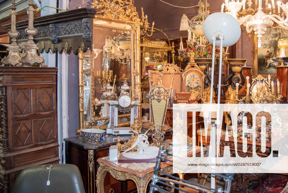 Paris, France. August 2022. One of the many antique shops at the Saint Quen flea market in Paris. Paris, France. August 2022. One of the many antique shops at the Saint Quen flea market in Paris. High quality photo