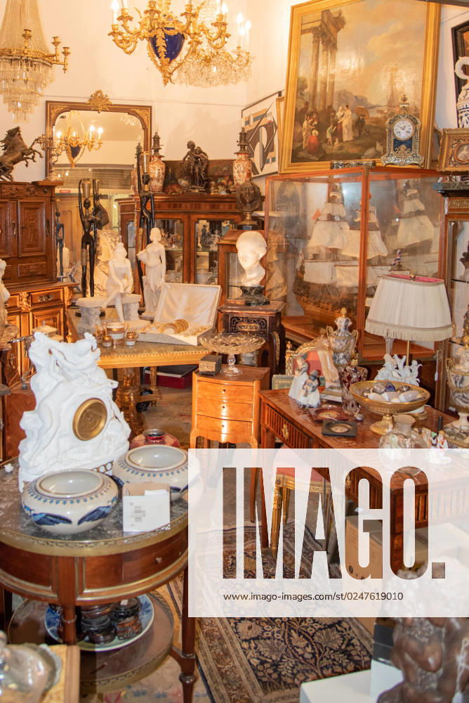 Paris, France. August 2022. One of the many antique shops at the Saint Quen flea market in Paris. Paris, France. August 2022. One of the many antique shops at the Saint Quen flea market in Paris. High quality photo