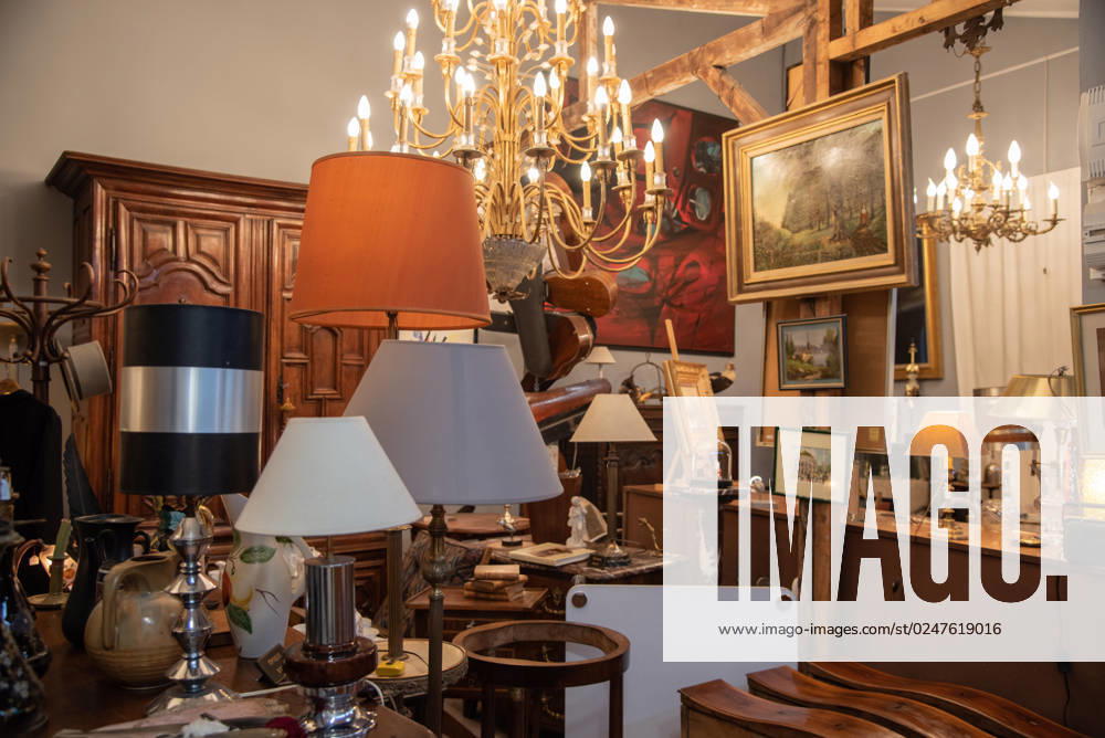Paris, France. August 2022. One of the many antique shops at the Saint Quen flea market in Paris. Paris, France. August 2022. One of the many antique shops at the Saint Quen flea market in Paris. High quality photo