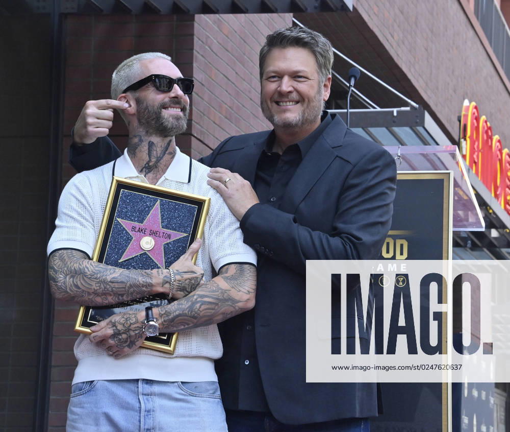 Singer and entertainer Blake Shelton is joined by singer Adam Levine during an unveiling ceremony honoring him with the 2,755th star on the Hollywood Walk of Fame on Friday, May 12, 2023. LAP2023051209 JIMxRUYMEN