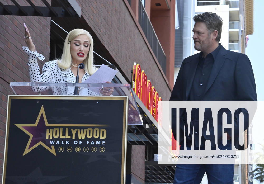 Singer and entertainer Blake Shelton ;listens to comments by his wife, singer Gwen Stefani during an unveiling ceremony honoring him with the 2,755th star on the Hollywood Walk of Fame on Friday, May 12, 2023. LAP2023051222 JIMxRUYMEN