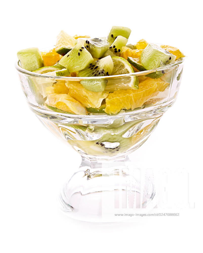 Cup with orange, kiwi and lime isolated on white