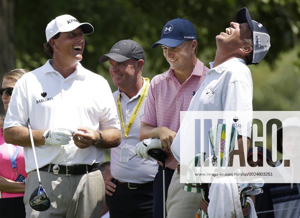 Phil Mickelson, Jordan Spieth and caddie Jim Bones Mackay smile on a tee box in a practice round at the PGA Golf Herren Championship at Baltusrol Golf Club in Springfield, New Jersey on July 26, 2016. PGA20160726117 JOHNxANGELILLO