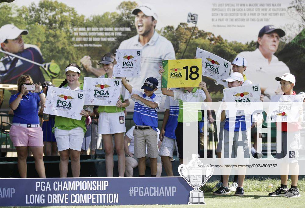 Fans hold up 18th hole flags to be signed by players at the PGA Golf Herren Championship at Baltusrol Golf Club in Springfield, New Jersey on July 26, 2016. PGA20160726123 JOHNxANGELILLO
