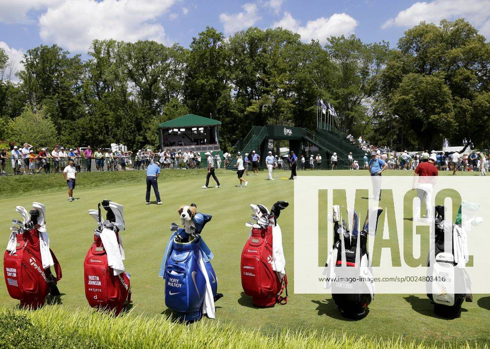 Bags of clubs including ones from Dustin Johnson and Rory McIlroy stand on the edge of the practice green at the PGA Golf Herren Championship at Baltusrol Golf Club in Springfield, New Jersey on July 26, 2016. PGA20160726108 JOHNxANGELILLO