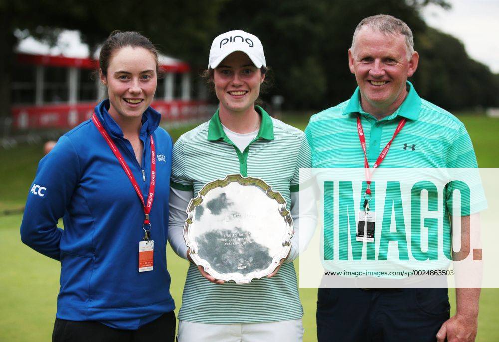 Woburn, United Kingdom - L-R Caddie (L) Amateur Leona Maguire of Ireland (M) poses with the Moira Smyth Silver Salver after finishing as the leading amateur and her Dad Declan Maguire during The Ricoh Women s British Open played at Woburn Golf and Country Club, Woburn on July 31st 2016. Ricoh Women s British Open 2016 Day Four - ZUMAn230