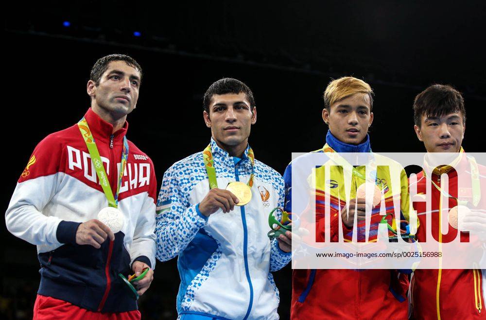 Silver medallist Mikhail Aloyan of Russia, gold medallist Shakhobidin Zoirov of Uzbekistan, bronze medallists Yoel Segundo Finol of Venezuela and Hu Jiangyan of China (L-R) pose at the victory ceremony for the men s fly 52kg boxing event at the Rio 2016 Summer Olympic Games Olympische Spiele Olympia OS at Riocentro Pavilion 6. Valery Sharifulin TASS TS02E1F1
