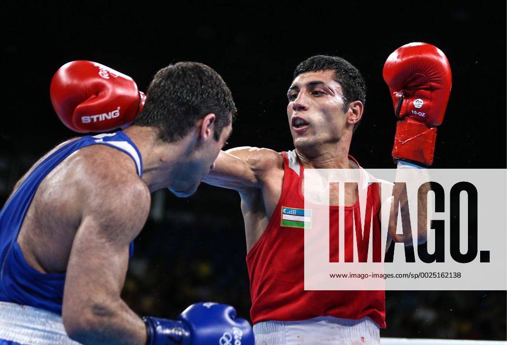 Russia s Mikhail Aloyan (L) fights against Uzbekistan s Shakhobidin Zoirov in their men s fly 52kg boxing gold medal bout at the Rio 2016 Summer Olympic Games Olympische Spiele Olympia OS at Riocentro Pavilion 6. Zoirov won the bout. Valery Sharifulin TASS TS02E27E