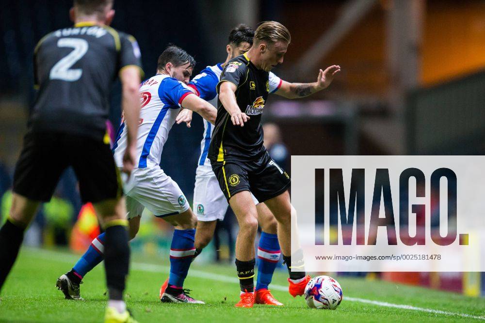 Ewood Park, Blackburn, England. EFL Cup Football. Blackburn Rovers versus Crewe Alexandra. Crewe Alexandra midfielder George Cooper is tackled by Blackburn Rovers midfielder Craig Conway. Williamsx ActionPlus11779514