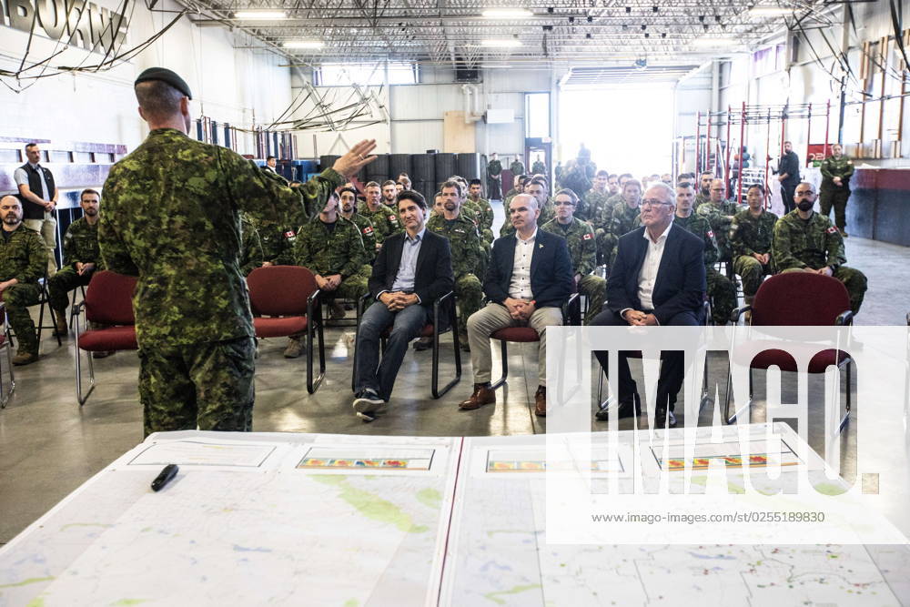 Prime Minister Justin Trudeau, MP Randy Boissonnault, centre and MP Bill Blair meet with members of the Canadian Armed Forces who are assisting in the Alberta wildfires, in Edmonton on Monday May 15, 2023. EDMONTON CANADA - ZUMAc35_ 20230515_zaf_c35_026