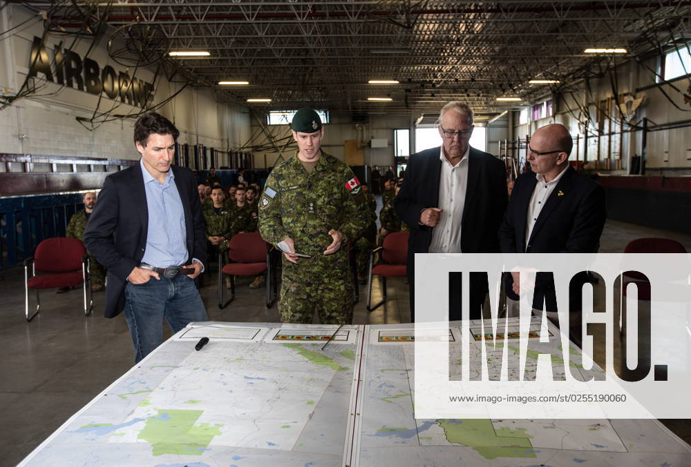 From left, Prime Minister Justin Trudeau, Colonel Ben Schmidt, MP Randy Boissonnault, and MP Bill Blair meet with members of the Canadian Armed Forces who are assisting in the Alberta wildfires, in Edmonton on Monday May 15, 2023. EDMONTON CANADA - ZUMAc35_ 20230515_zaf_c35_027