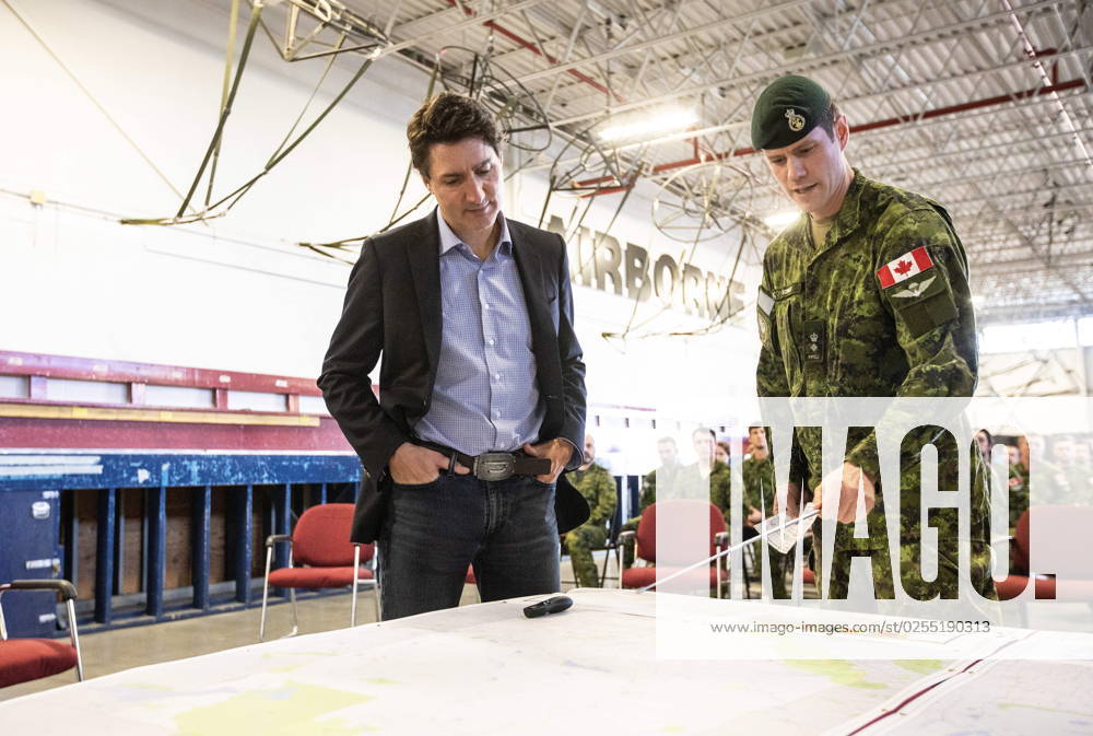 Prime Minister Justin Trudeau and Colonel Ben Schmidt discuss the Alberta wildfires while meeting with members of the Canadian Armed Forces who are assisting in the Alberta wildfires, in Edmonton on Monday, May 15, 2023. EDMONTON CANADA - ZUMAc35_ 20230515_zaf_c35_030