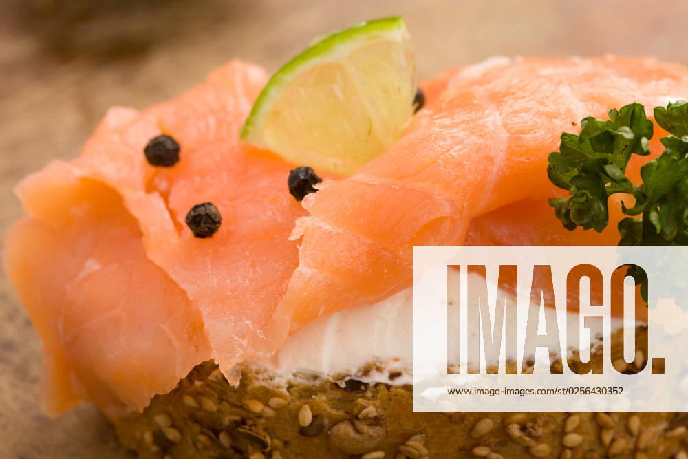 Photo of delicious crispy cereals bread with smoked salmon