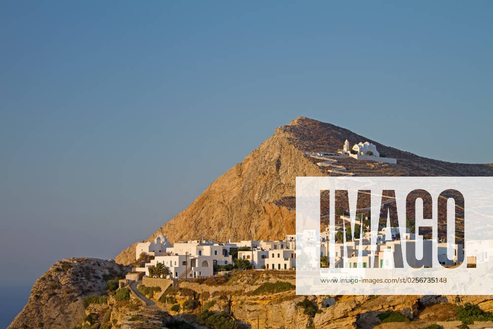 The picturesque town of Chora on Folegandros island, Greece, at sunset; the church of Virgin Mary sits on top of it