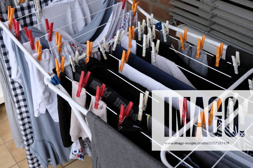 Dusseldorf 20 05 2023 clothes horse colorful clothes line clothespins sustainable environmentally friendly wet laundry air drying balcony solar energy wind energy sunlight solar heat solar heat save electricity no clothes dryer power consumption Dusseldorf North Rhine Westphalia Germany
