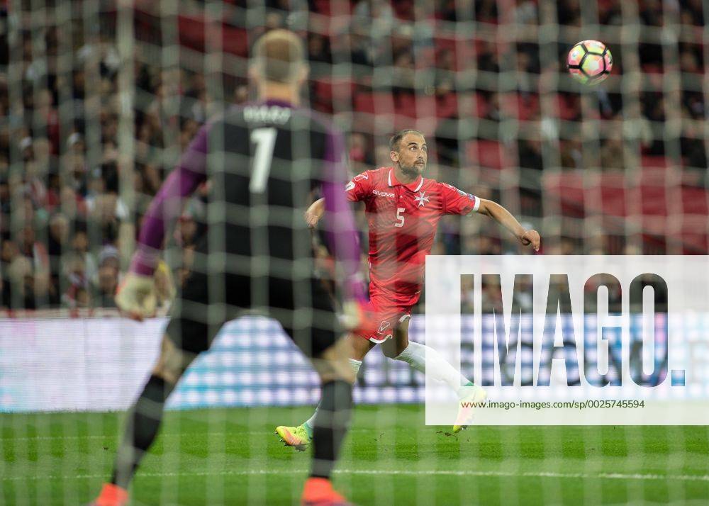 Football - 2016 2016 World Cup Qualifier - Group F: England vs. Malta Malta s Andrei Agius keeps his eye on the ball as he forces Joe Hart to save his volley at Wembley. COLORSPORT DANIEL BEARHAM whu_mid