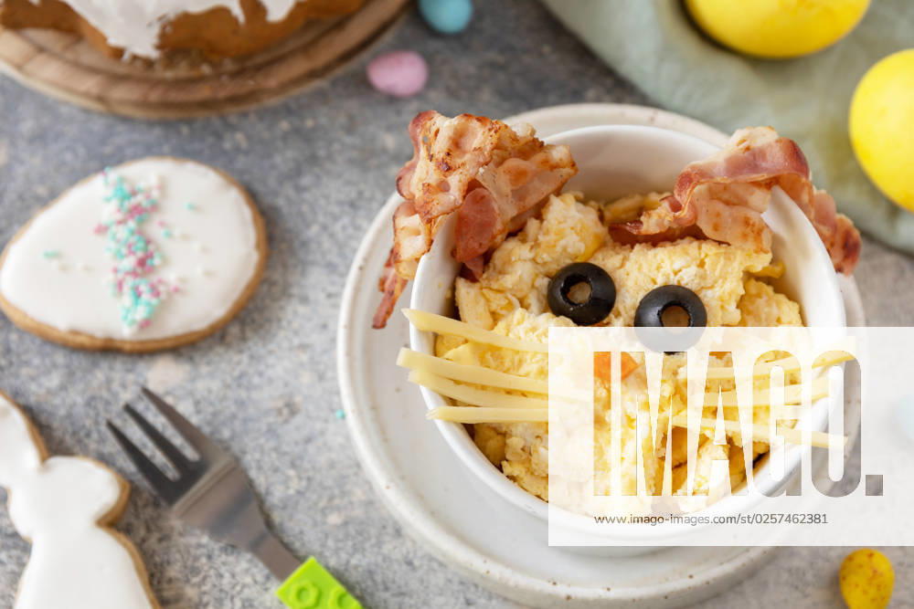Scrambled eggs easter bunny on a stone background. Easter breakfast idea. Scrambled eggs easter bunny on a stone background. Easter breakfast idea.