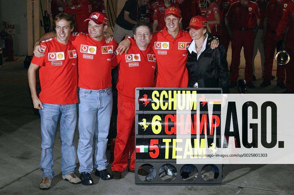 Luca Badoer Rubens Barrichello Jean Todt Michael und Corinna Schumacher jubeln beim Großen Preis von Japan in Suzuka. Copyright Thomas Pakusch