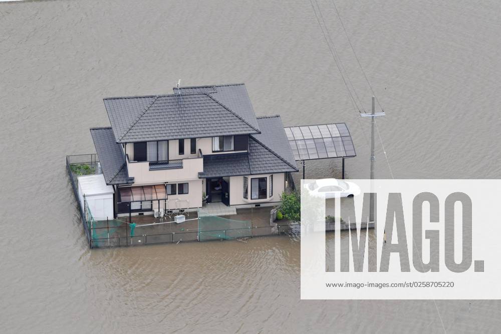 Heavy rain in Japan Photo taken on June 3, 2023, from a Kyodo News helicopter shows a house surrounded by floodwaters in the Aichi Prefecture city of Toyokawa, central Japan, following heavy rain brought about by Typhoon Mawar. A14AA0001544150P