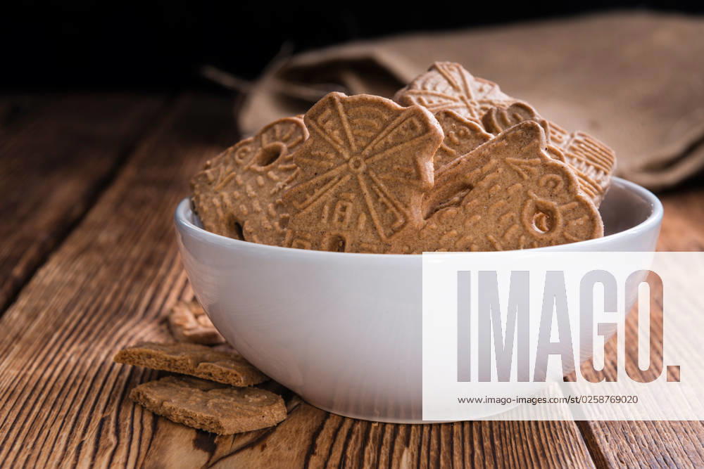 Heap of fresh baked Spekulatius Heap of fresh baked Spekulatius (German cuisine) on wooden background