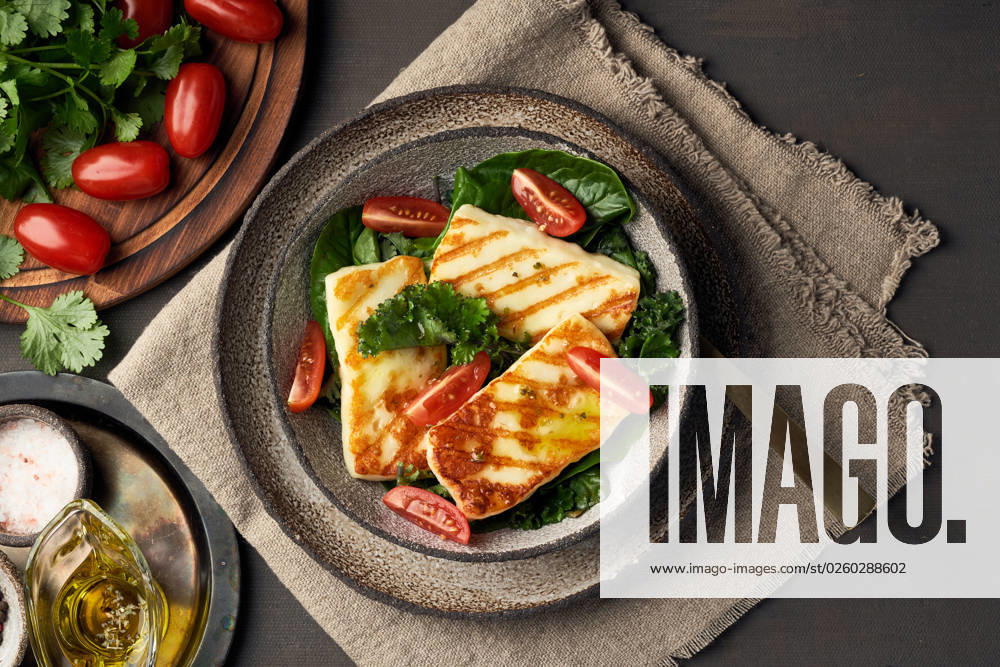 Cyprus fried halloumi cheese with healthy green salad. Lchf, pegan, fodmap, paleo, scd, keto diet. Cyprus fried halloumi cheese with healthy green salad. Lchf, pegan, fodmap, paleo, scd, keto, ketogenic diet. Balanced food, a greek clean eating recipe.