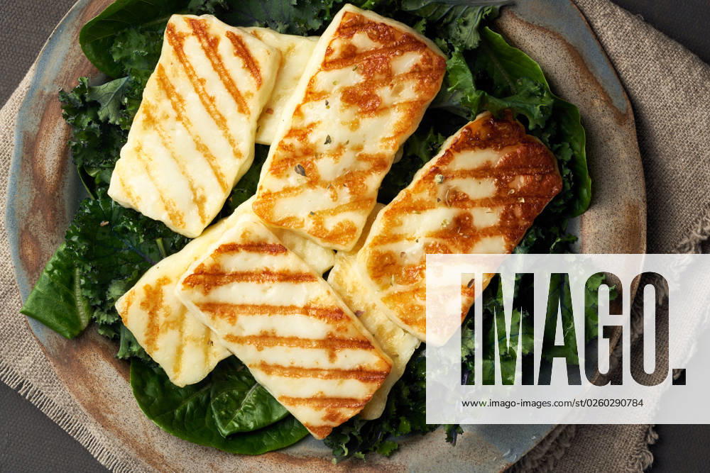 Cyprus fried halloumi cheese with healthy green salad. Lchf, pegan, fodmap, paleo, scd, keto diet. Keto, ketogenic diet. Cyprus fried halloumi cheese with healthy green salad. Lchf, pegan, fodmap, paleo, scd. Balanced food, a greek clean eating recipe, close up