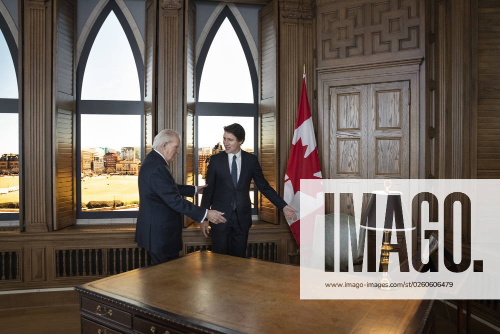 Prime Minister Justin Trudeau, right, is offered a seat at the desk by former prime minister Brian Mulroney while touring a replica of Mr. Mulroney s former parliamentary office in Mulroney Hall at St. Francis Xavier University in Antigonish, N.S. on Monday, June 19, 2023. Antigonish Canada - ZUMAc35_ 20230619_zaf_c35_070