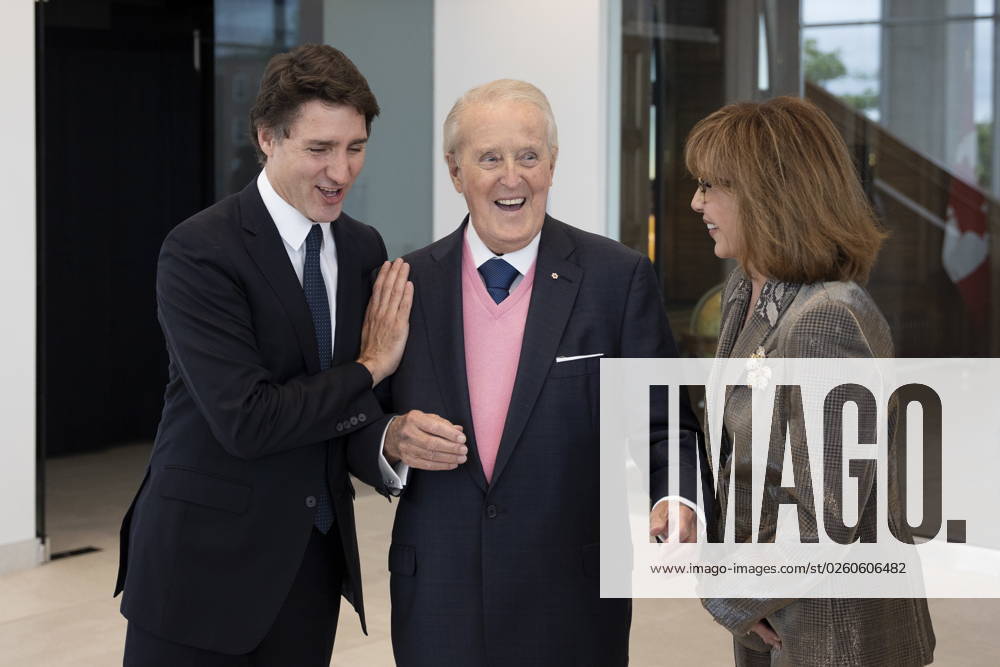 Former prime minister Brian Mulroney, centre, laughs while he and his wife Mila Mulroney, right, greet Prime Minister Justin Trudeau in Mulroney Hall at St. Francis Xavier University in Antigonish, N.S. on Monday, June 19, 2023. Antigonish Canada - ZUMAc35_ 20230619_zaf_c35_072