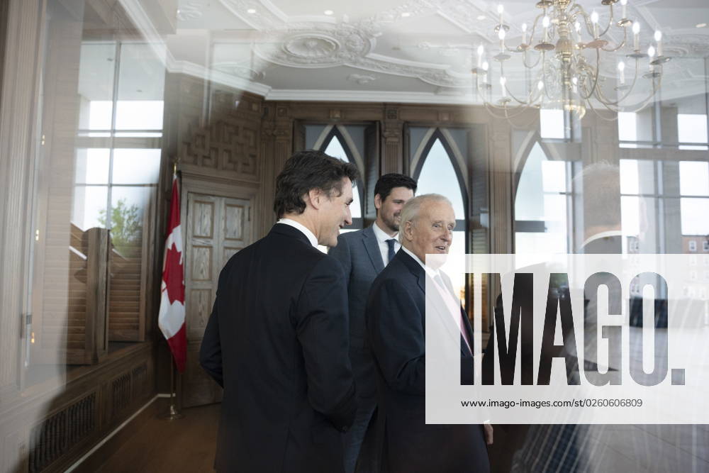 Prime Minister Justin Trudeau, left, Sean Fraser, centre, minister of Immigration, Refugees and Citizenship, and former prime minister Brian Mulroney are seen through glass, while touring a replica of Mr. Mulroney s former parliamentary office in Mulroney Hall at St. Francis Xavier University in Antigonish, N.S. on Monday, June 19, 2023. Antigonish Canada - ZUMAc35_ 20230619_zaf_c35_074