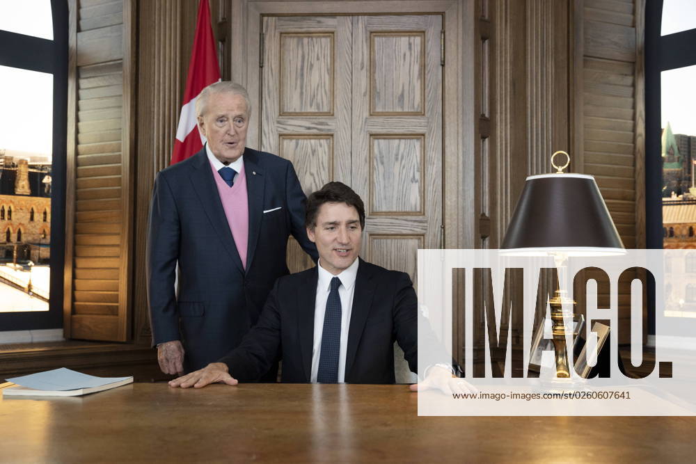 Prime Minister Justin Trudeau, right, sits behind the desk of former prime minister Brian Mulroney, left, while touring a replica of Mr. Mulroney s former parliamentary office in Mulroney Hall at St. Francis Xavier University in Antigonish, N.S. on Monday, June 19, 2023. Antigonish Canada - ZUMAc35_ 20230619_zaf_c35_079