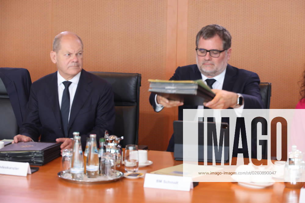 Federal Cabinet Berlin Scholz 21 06 2023, Germany, Berlin,Federal Cabinet, here Chancellor Olaf Scholz bad-tempered at the cabinet table , next to him Chancellery Chief Wolfgang Schmidt with the file situation of the nation on the subject of climate protection law Berlin Berlin Germany
