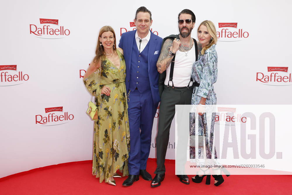 Alec Voelkel with his wife Johanna Michels and Sascha Vollmer with his wife Jenny at the Raffaello Summer Day Event on 21 6 2023 in Berlin Raffaello Summer Day Event 2023 in Berlin