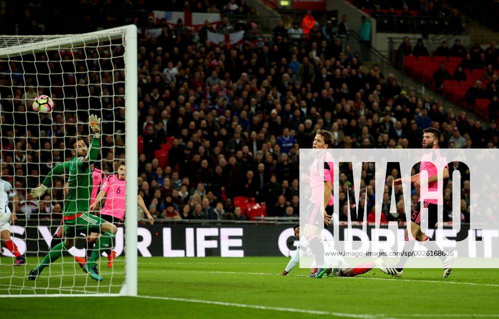 Daniel Sturridge of England heads the opening goal past Craig Gordon of Scotland during the FIFA World Cup WM Weltmeisterschaft Fussball Qualifying Group F match at Wembley Stadium, London. Picture date: November 11th, 2016. Pic David Klein Sportimage .