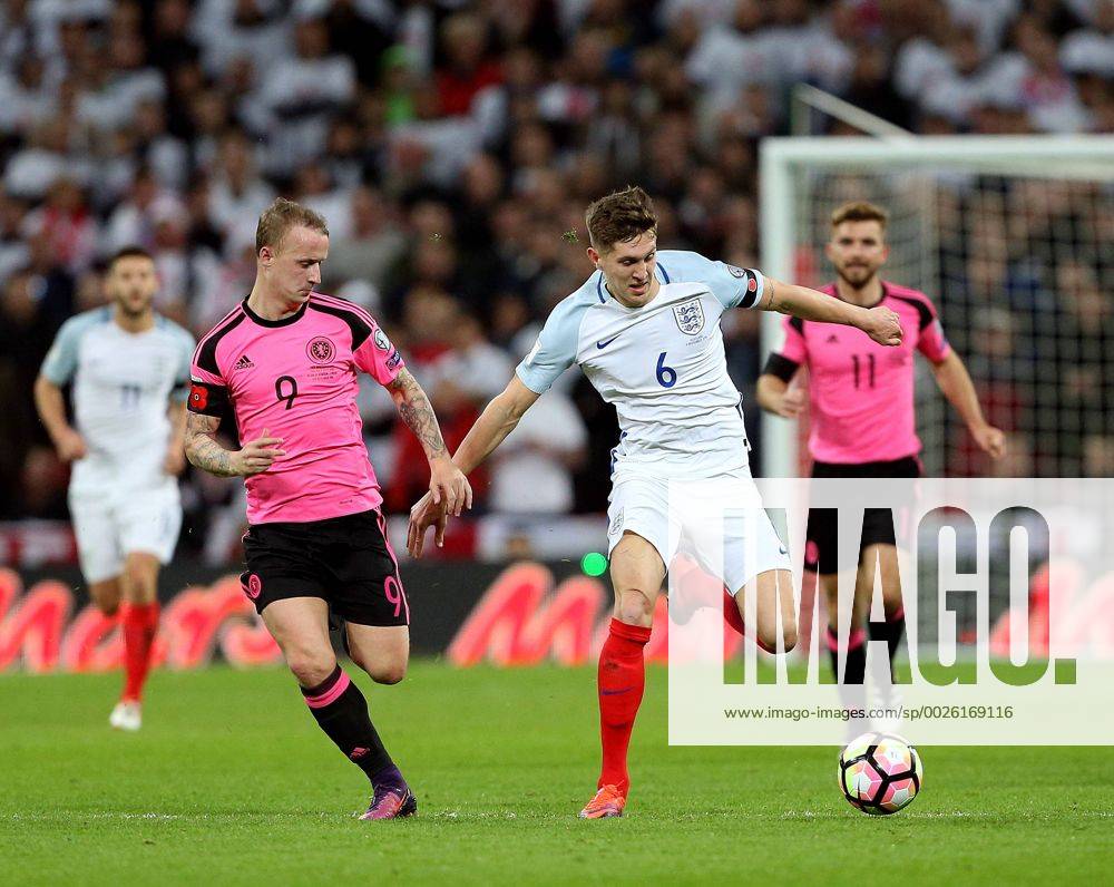 Leigh Griffiths of Scotland tussles with John Stones of England during the FIFA World Cup WM Weltmeisterschaft Fussball Qualifying Group F match at Wembley Stadium, London. Picture date: November 11th, 2016. Pic David Klein Sportimage .
