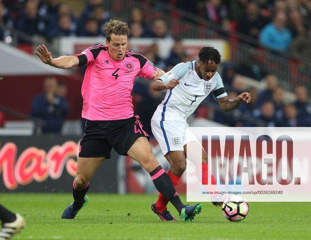 Christophe Berra of Scotland tackles Raheem Sterling of England during the FIFA World Cup WM Weltmeisterschaft Fussball Qualifying Group F match at Wembley Stadium, London. Picture date: November 11th, 2016. Pic David Klein Sportimage .