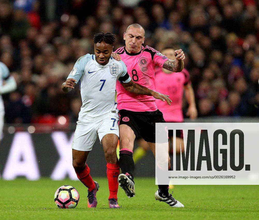 Raheem Sterling of England tackled by Scott Brown of Scotland during the FIFA World Cup WM Weltmeisterschaft Fussball Qualifying Group F match at Wembley Stadium, London. Picture date: November 11th, 2016. Pic David Klein Sportimage .