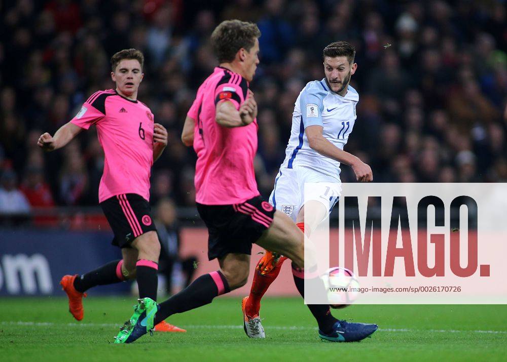 Wembley Stadium, London, England. World Cup Qualifying Football. England versus Scotland. Adam Lallana of England has his shot blocked by Christophe Berra of Scotland Kertonx ActionPlus11808512