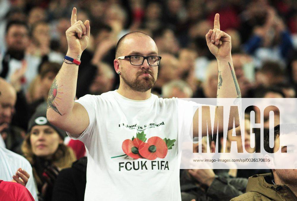 Football - 2016 2017 World Cup Qualifier - Group F: England vs. Scotland England fan with a message to FIFA over the wearing of a poppy at Wembley. COLORSPORT ANDREW COWIE