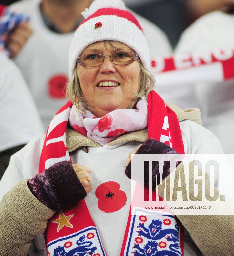 Football - 2016 2017 World Cup Qualifier - Group F: England vs. Scotland England supporter wearing her poppy at Wembley. COLORSPORT ANDREW COWIE