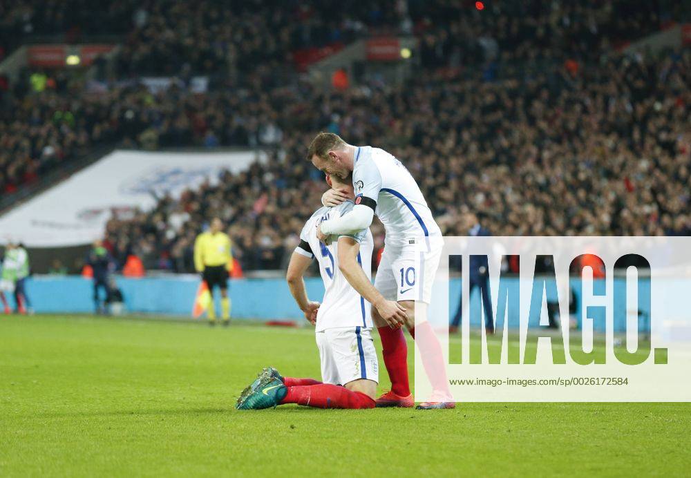 LONDON, Nov. 11, 2016 -- Wayne Rooney (R) of England celebrates Gary Cahill s goal during the Group F match between England and Scotland at 2018 FIFA World Cup WM Weltmeisterschaft Fussball European Qualifiers at Wembley Stadium in London, England on Nov. 11, 2016. England won 3-0. ) (SP)BRITAIN-LONDON-FOOTBALL-FIFA WORLD CUP QUALIFIER-ENGLAND VS SCOTLAND HanxYan