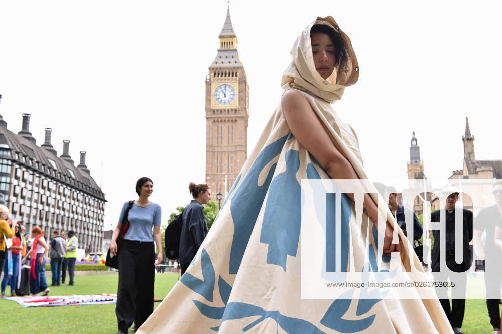 The activist is wearing a real UNHCR camp tent, where a Syrian family lived in one of the refugee camps in Jordan. Grassroots Activist group Citizens UK and school children protest against the Governmentâ€⠢s Illegal Migration Bill which could detain kids. Under the legislation, youngsters arriving in the UK aboard inflatables crossing the Channel could be deported. London United Kingdom - ZUMAk172 20230627_zip_k172_053