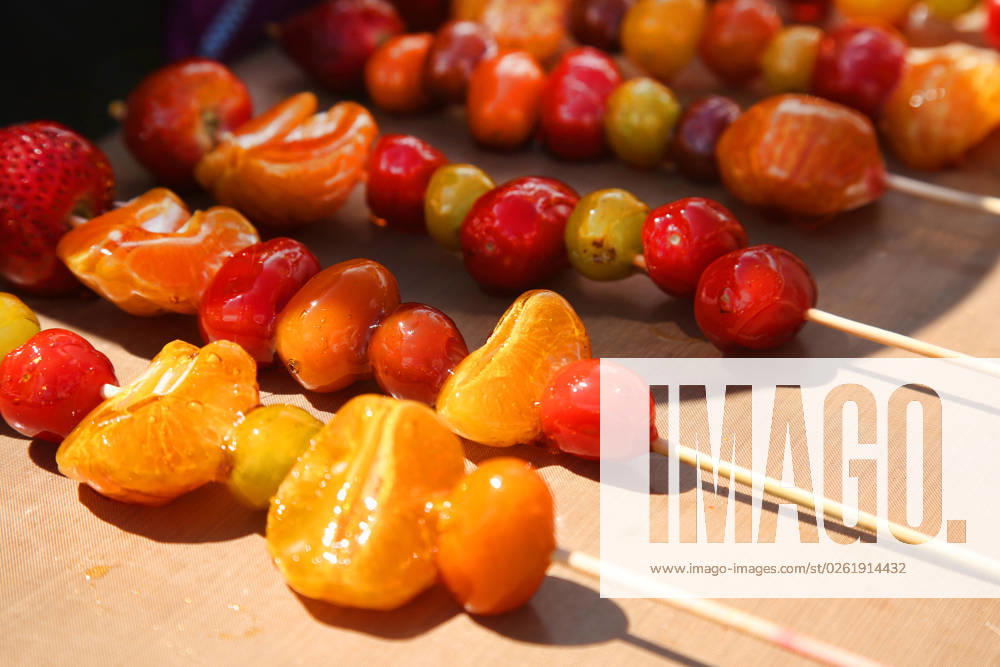 Tanghulu Candied Fruit Skewers Tanghulu candied fruit skewers during the Taste of Asia Food Festival in Markham, Ontario, Canada, on June 24, 2023. The festival is the largest Asian festival in Canada with over 180,000 attendees each year. Tanghulu or Tang hulu, also called bingtang hulu, is a traditional Northern Chinese snack consisting of several rock sugar-coated fruits on a bamboo skewer. Markham Ontario Canada