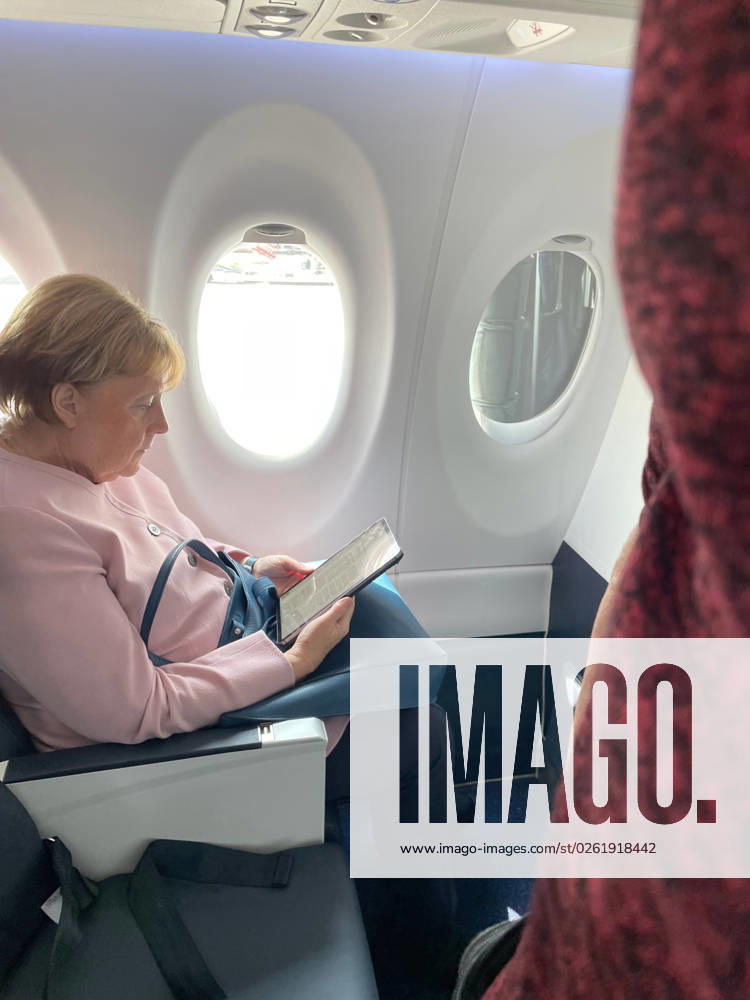 Former German Chancellor Angela Merkel on a commerical flight from Paris to Berlin Berlin Germany - ZUMAu22_ 20230628_zap_u22_001