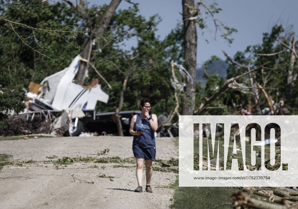 A woman looks for her belongings after a tornado damaged homes near Carstairs, Alta., Saturday, July 1, 2023. No injuries were reported. Carstairs CANADA - ZUMAc35_ 20230701_zaf_c35_134