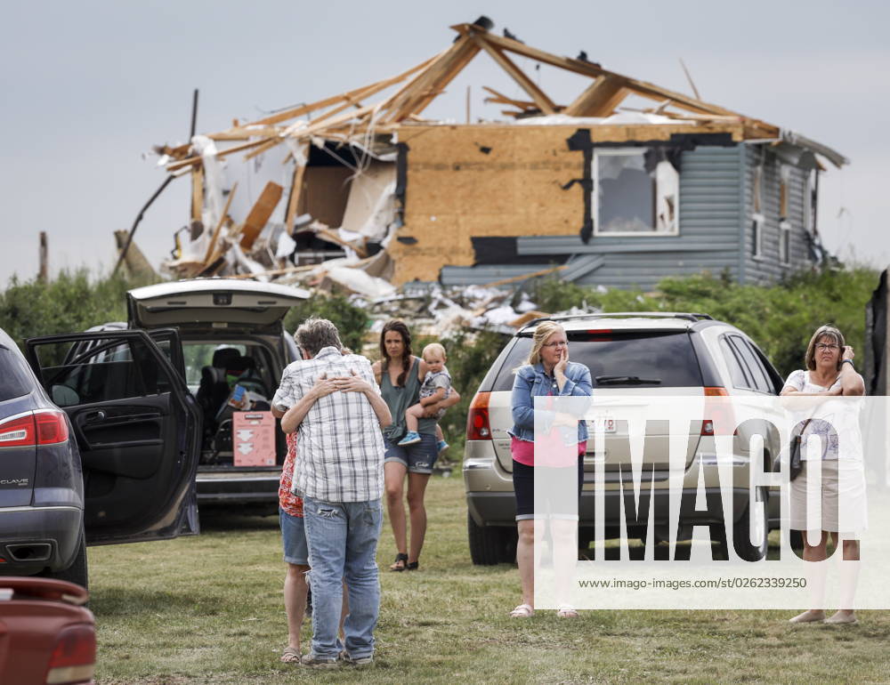 People embrace after a tornado damaged homes near Carstairs, Alta., Saturday, July 1, 2023. No injuries were reported. Carstairs CANADA - ZUMAc35_ 20230701_zaf_c35_140