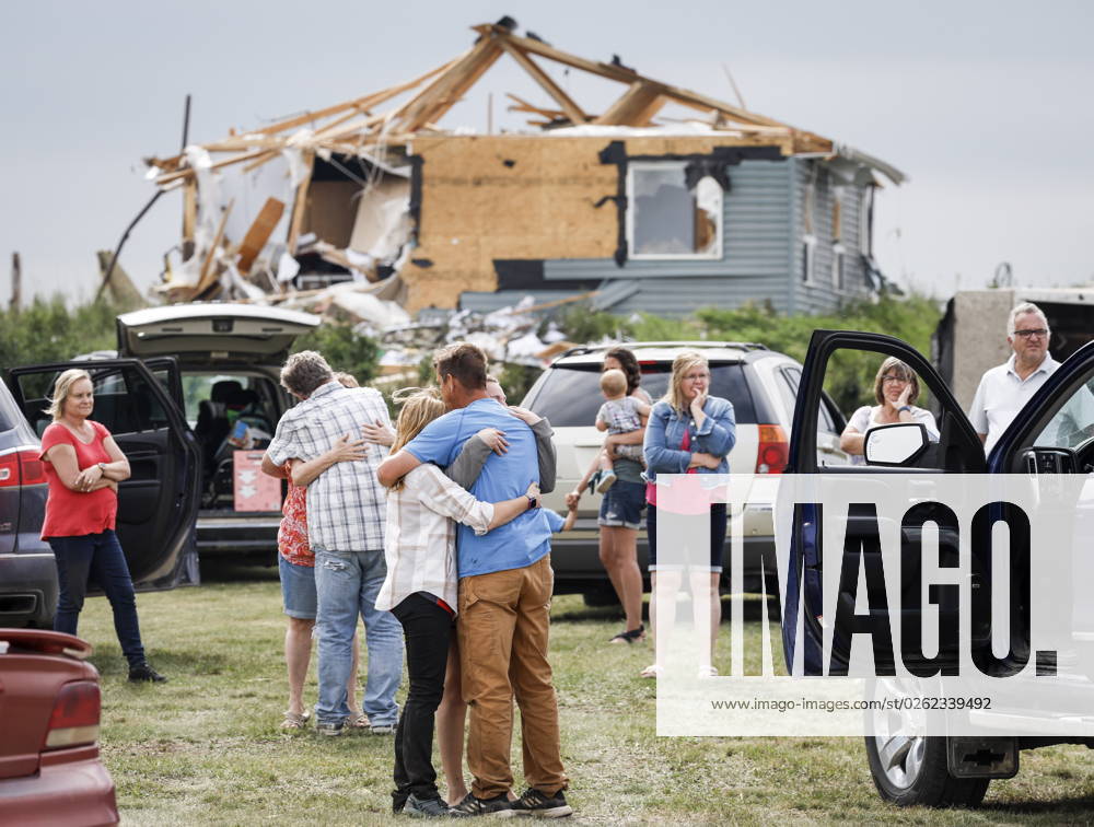 People embrace after a tornado damaged homes near Carstairs, Alta., Saturday, July 1, 2023. No injuries were reported. Carstairs CANADA - ZUMAc35_ 20230701_zaf_c35_141