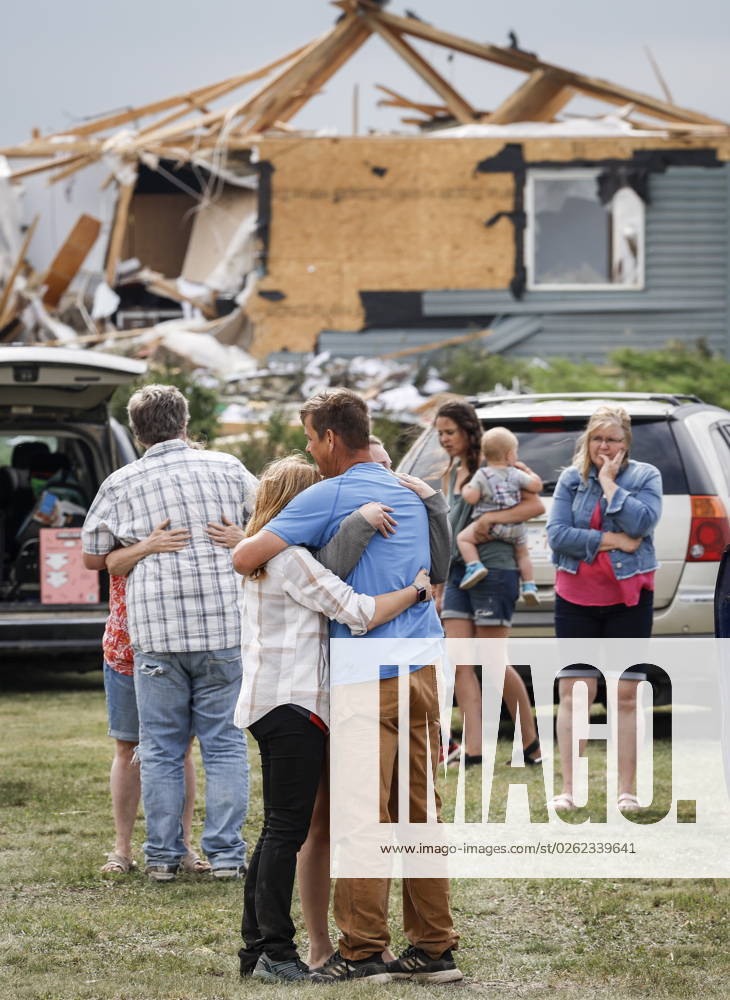 People embrace after a tornado damaged homes near Carstairs, Alta., Saturday, July 1, 2023. No injuries were reported. Carstairs CANADA - ZUMAc35_ 20230701_zaf_c35_142