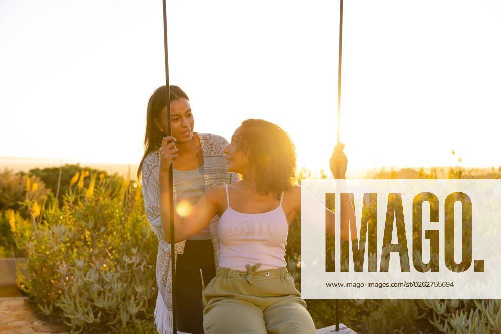 Happy biracial lesbian couple swinging on swing in sunny garden Happy biracial lesbian couple swinging on swing in sunny garden. Lifestyle, relationship, togetherness, nature and domestic life, unaltered., model released, , property released, Cape Town, South Africa, 2023-03-01T22:00:00.000Z, 4076106.jpg, people,happy,biracial,lesbian,couple,swinging,swing,sunny,garden,lifestyle,relationship,togetherness,nature,domestic life,unaltered,summer,outdoor,beautiful,together,natural,green,plant,young,spring,love,landscape,leisure,park,beauty,homosexual,lgbt,outdoors,family,domestic,life Young Adult,Woman,Female,Multiracial,Mid Adult,Black