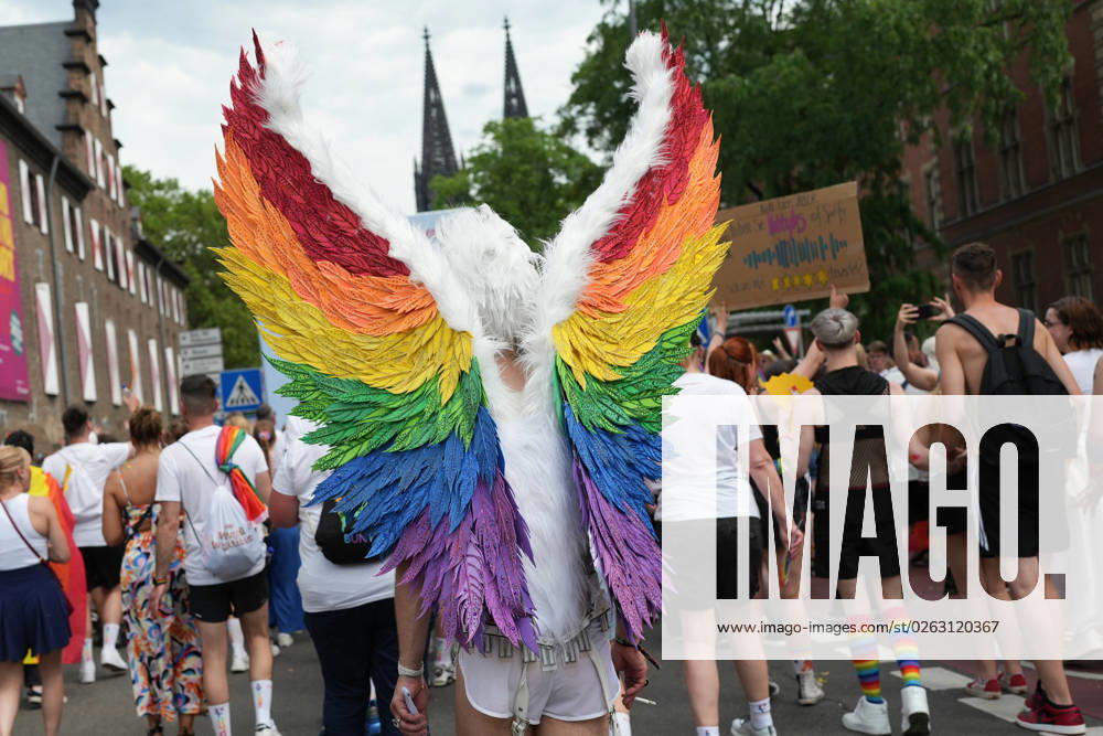 CSD Pride Parade 2023 in Cologne participants with wings and rainbow colors with the cathedral in the background during the CSD Pride Parade through the city center of Cologne, Cologne, 09 07 2023 Cologne Cologne Germany