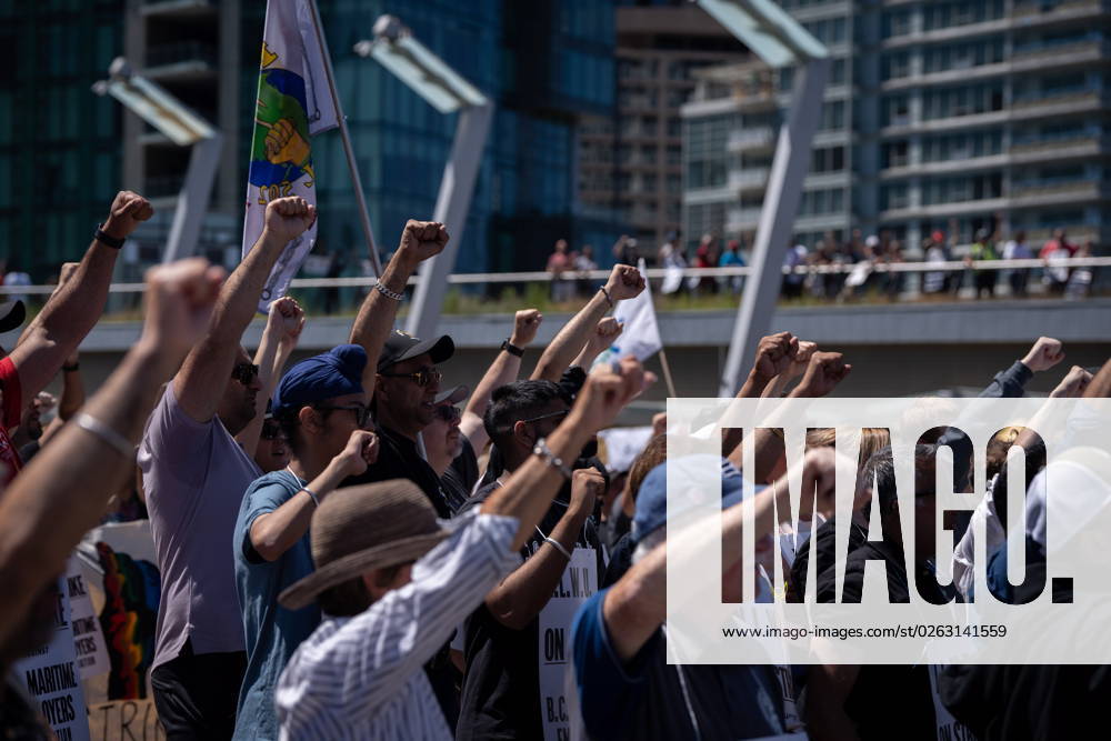 Striking port workers from the International Longshore and Warehouse Union Canada hold up their fists while attending a rally in Vancouver, on Sunday, July 9, 2023. VANCOUVER CANADA - ZUMAc35_ 20230709_zaf_c35_044